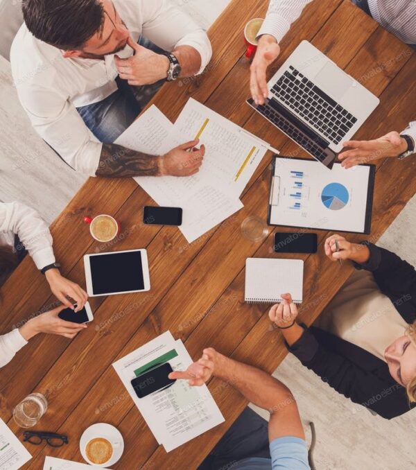 Group of busy business people working in office, top view